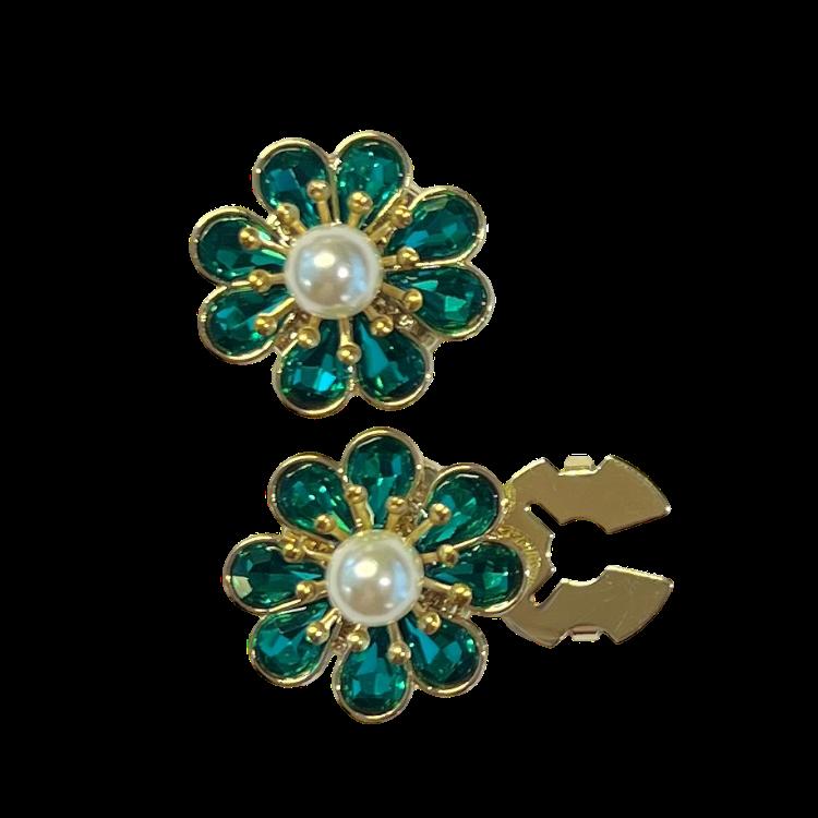 Sjøgrønn blomst med hvit perle